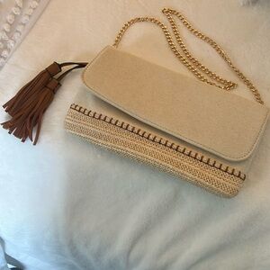 Urban expressions beige clutch with tassels & gold chain shoulder strap.